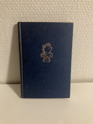 A blue book with a gold-coloured embossing of a Roman style bust of Winnie-The-Pooh.